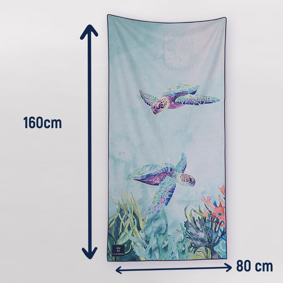 A beach towel or tapestry featuring an underwater scene with two sea turtles and coral, shown with dimension arrows and labels indicating 160 cm height and 80 cm width on a light gray background.