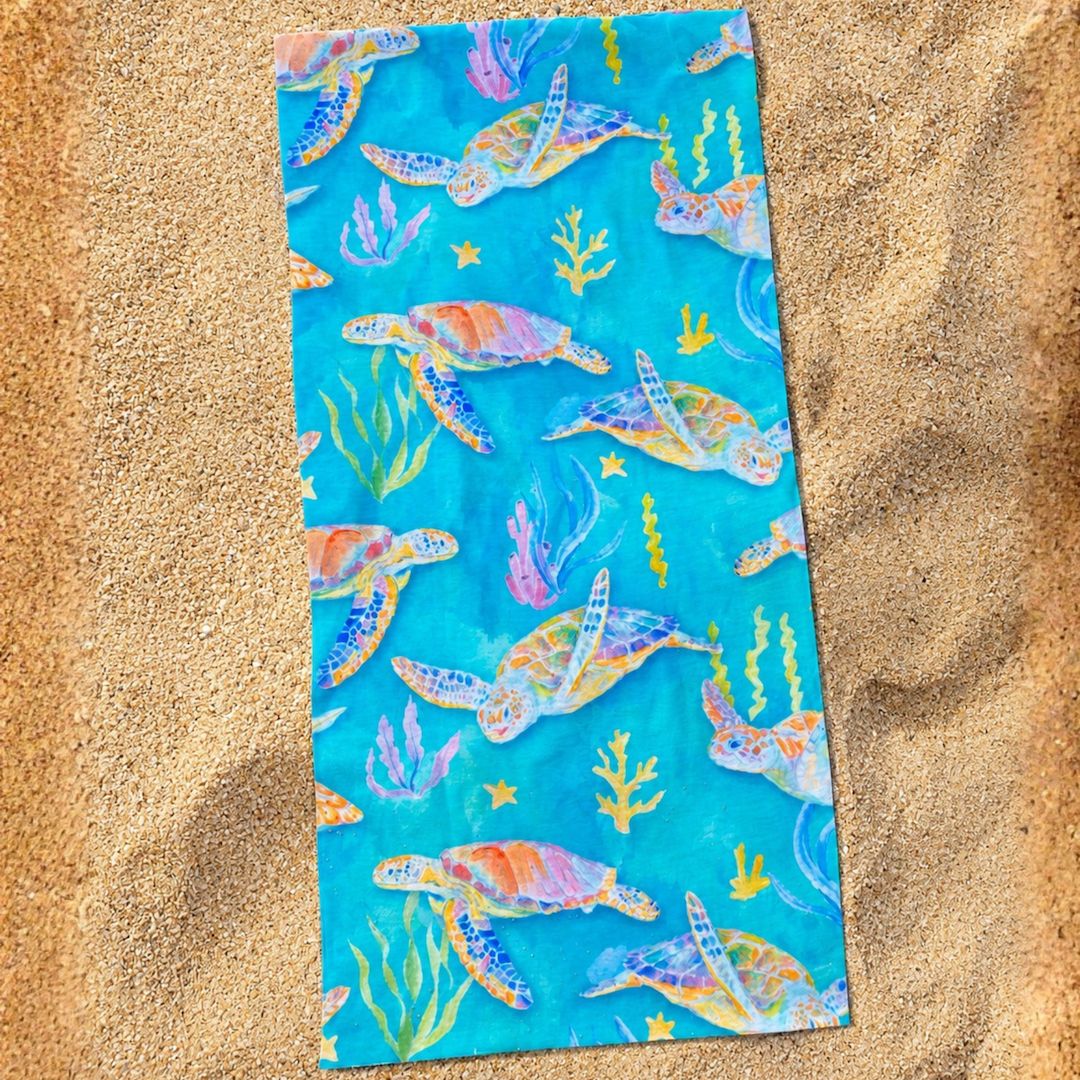 Sea turtle patterned sun buff featuring colorful ocean-inspired artwork with turtles, coral, and seaweed
